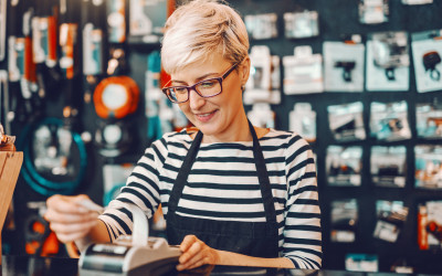 A lady billing for grocery retail products